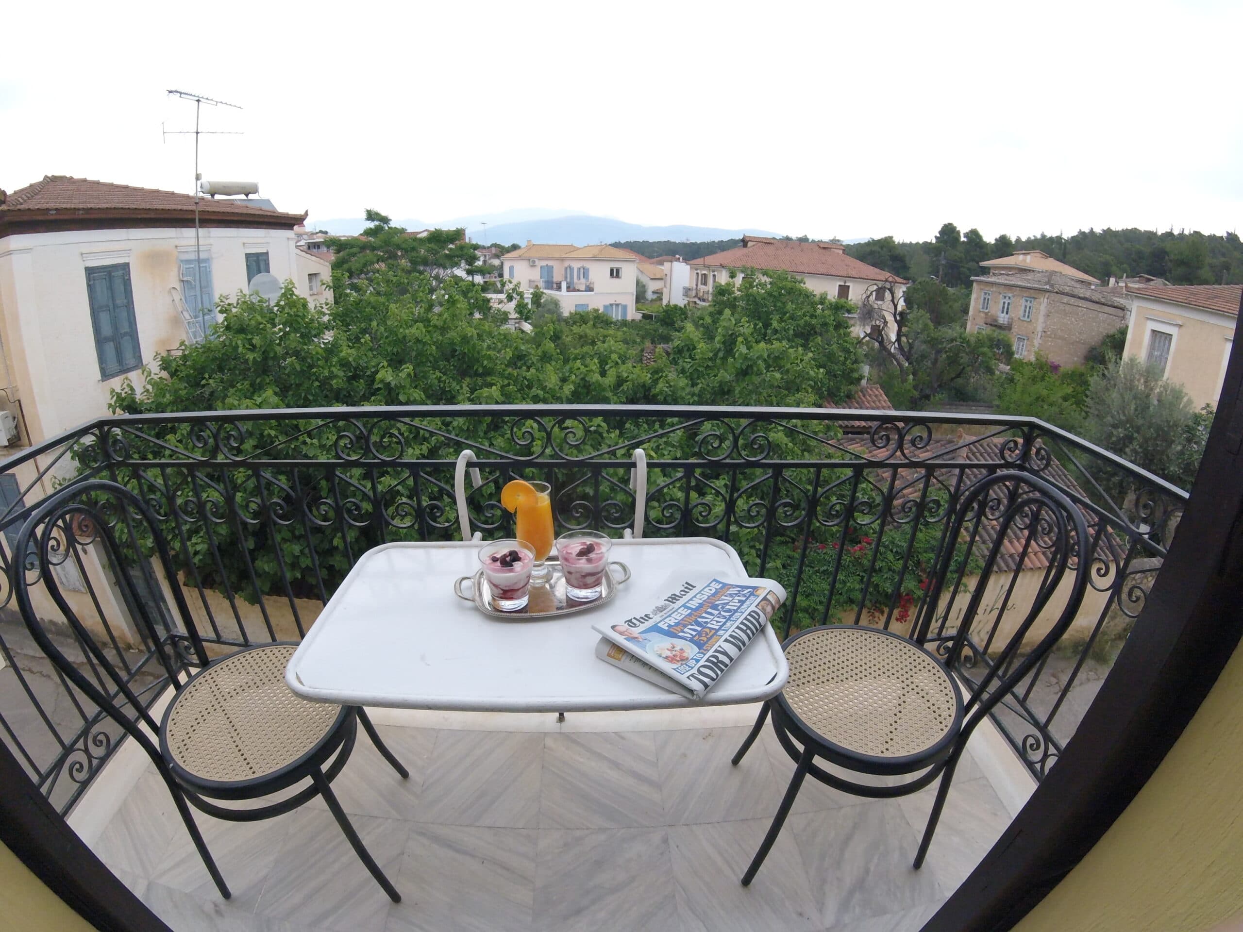Breakfast for two on a private balcony above the rooftops of Galaxidi
